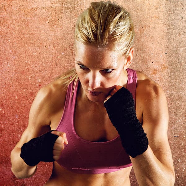 Mixed Martial Arts Lessons for Adults in Flushing NY - Lady Kickboxing Focused Background