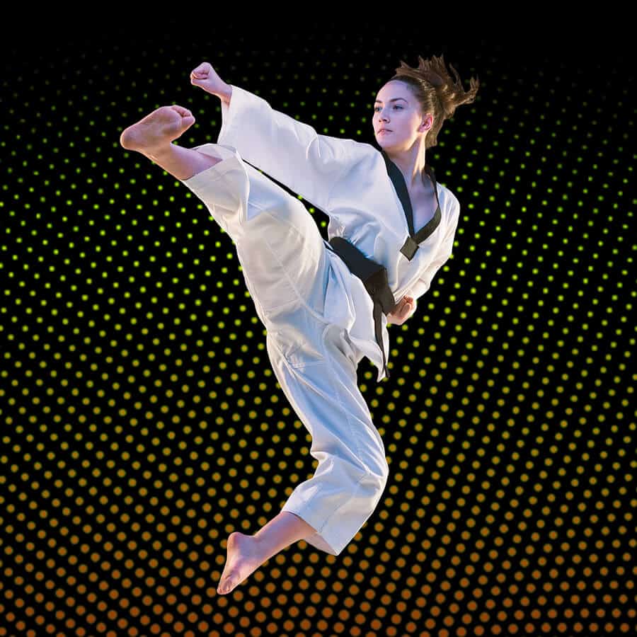 Martial Arts Lessons for Adults in Flushing NY - Girl Black Belt Jumping High Kick
